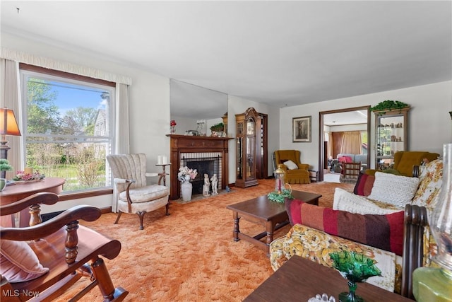 living room featuring a brick fireplace