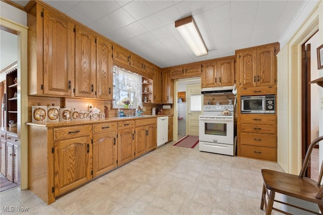 kitchen featuring under cabinet range hood, brown cabinetry, white appliances, open shelves, and light countertops