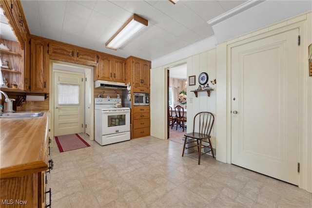 kitchen featuring under cabinet range hood, stainless steel microwave, a sink, white range with electric cooktop, and open shelves