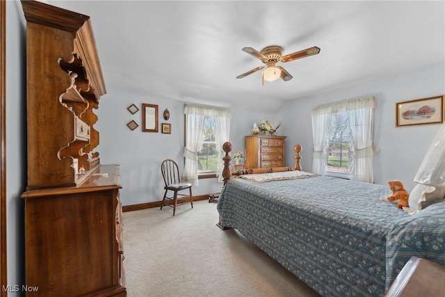 carpeted bedroom with baseboards and ceiling fan
