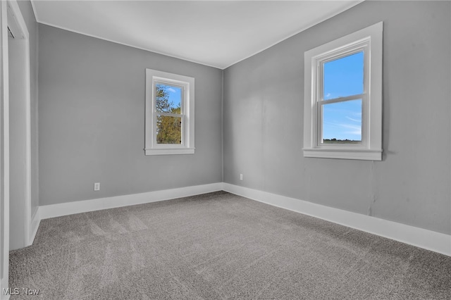 1250 Alamo Rd SE, Carrollton, OH 44615 - carpeted spare room with baseboards