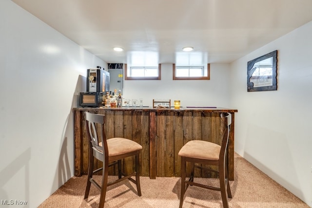 bar with a bar and carpet floors