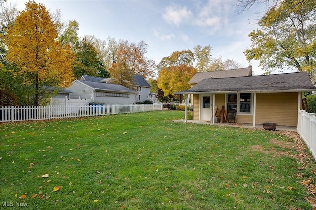 view of yard with a fenced backyard