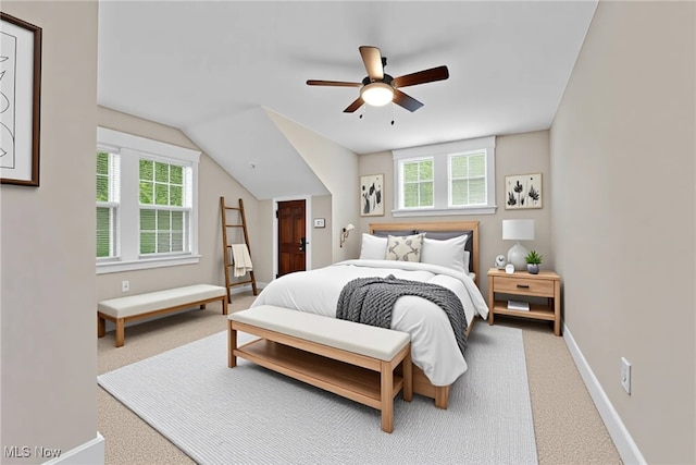 carpeted bedroom with baseboards and a ceiling fan