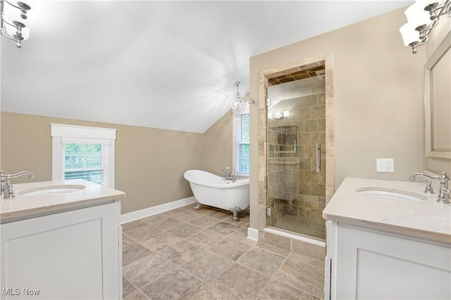 bathroom with a sink, two vanities, and a shower stall