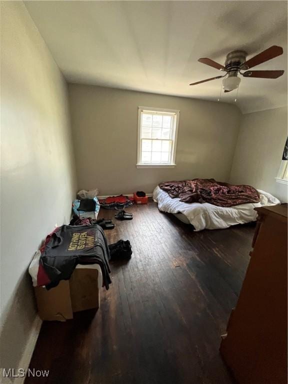 unfurnished bedroom featuring ceiling fan and hardwood / wood-style flooring