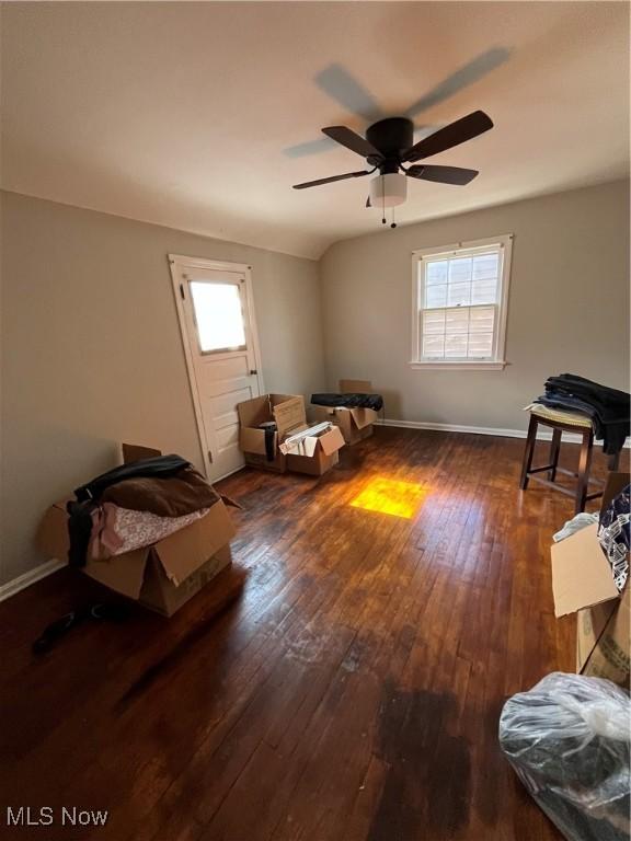 bedroom featuring baseboards and hardwood / wood-style floors