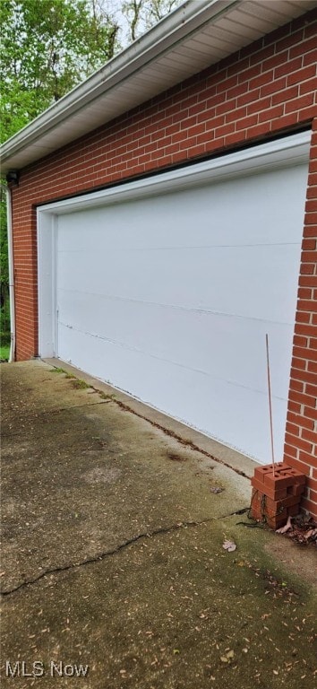 garage with concrete driveway