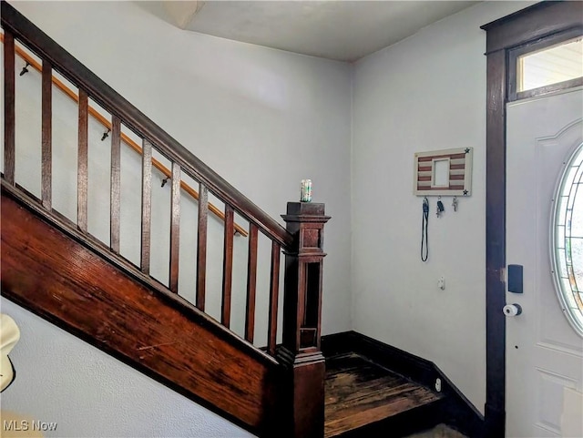 1510 Chester Ave, Wellsville, OH 43968 - foyer entrance with wood finished floors, stairway, baseboards, and a healthy amount of sunlight