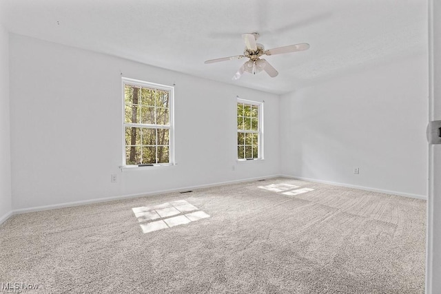 13109 Edison St NE, Alliance, OH 44601 - empty room featuring baseboards, ceiling fan, and carpet