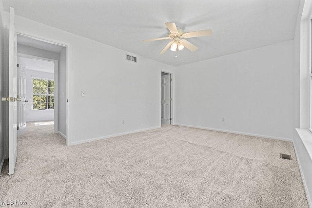 13109 Edison St NE, Alliance, OH 44601 - spare room with visible vents, ceiling fan, and carpet floors