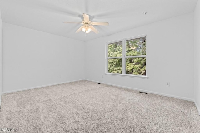 13109 Edison St NE, Alliance, OH 44601 - carpeted empty room featuring ceiling fan, baseboards, and visible vents