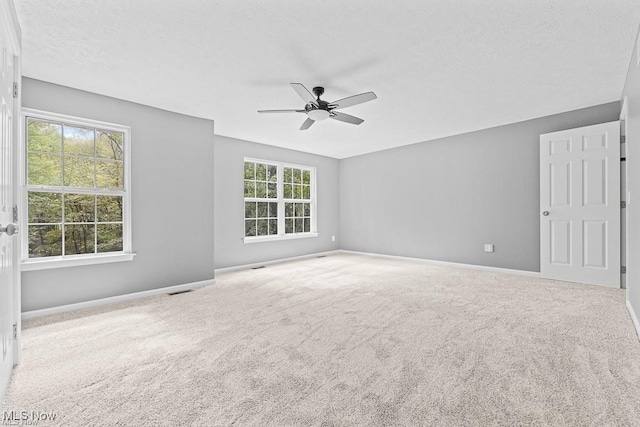 13109 Edison St NE, Alliance, OH 44601 - spare room featuring baseboards, ceiling fan, and carpet floors