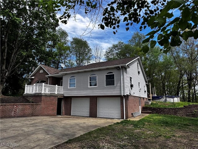 13978 Sprucevale Rd, East Liverpool, OH 43920 - view of front facade with concrete driveway, brick siding, and a garage