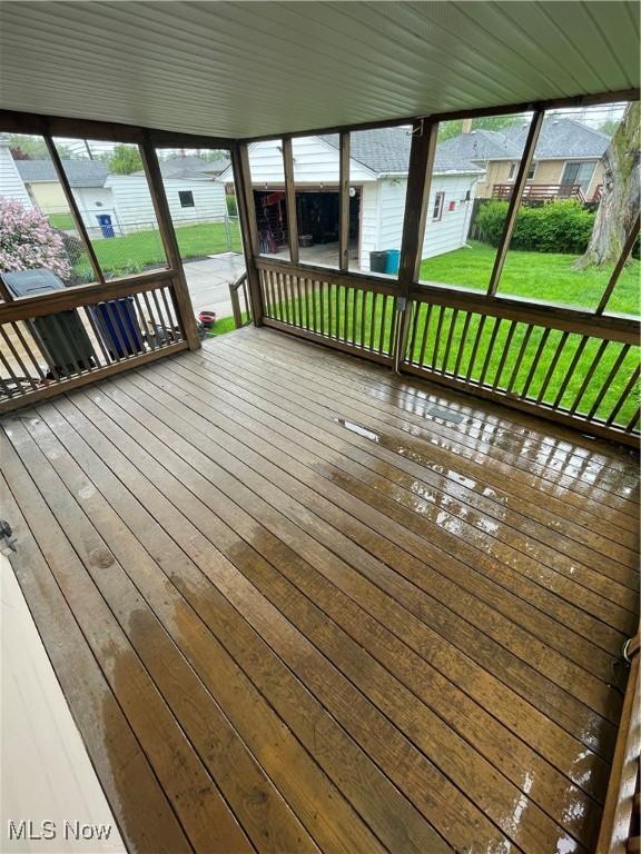 wooden deck with a yard