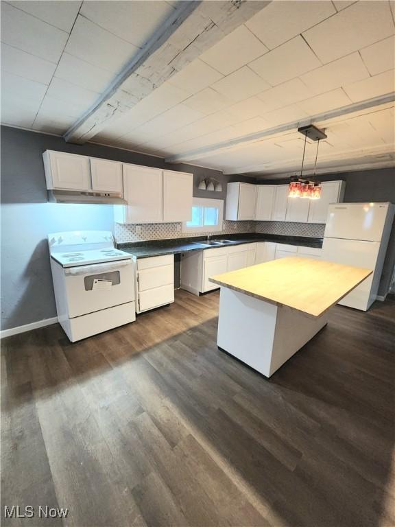 kitchen with white cabinetry, white appliances, dark wood finished floors, and a sink