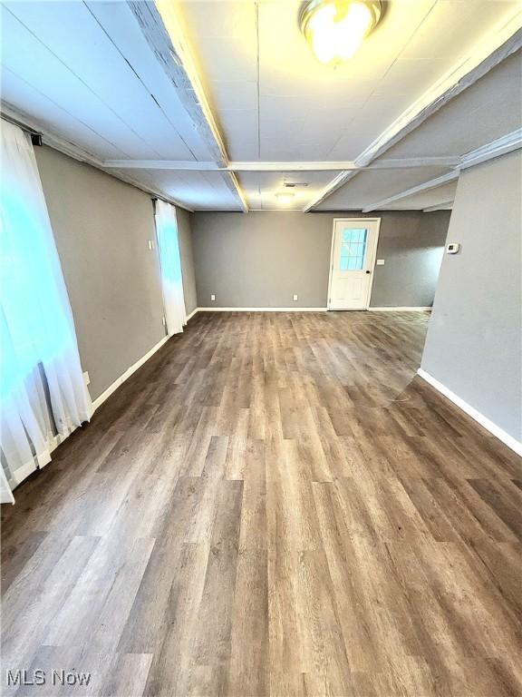 basement with wood finished floors and baseboards