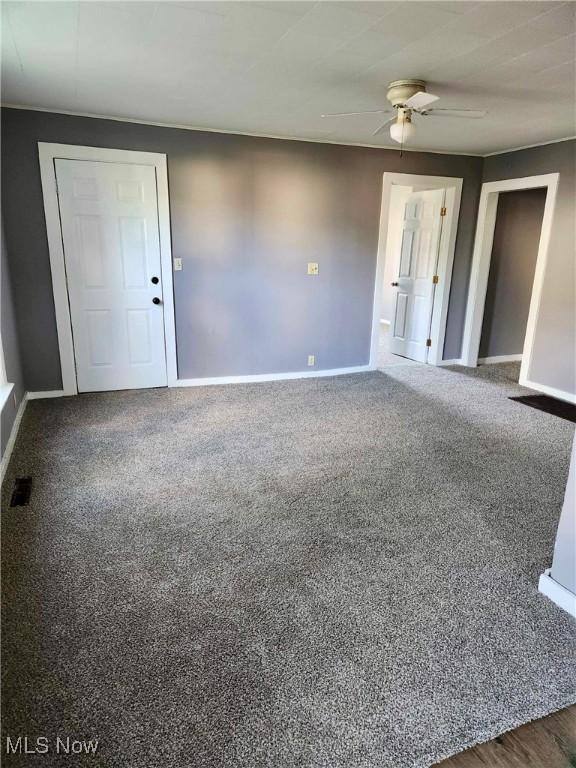 337 Foster Ave, Cambridge, OH 43725 - unfurnished room featuring baseboards, ceiling fan, and carpet flooring