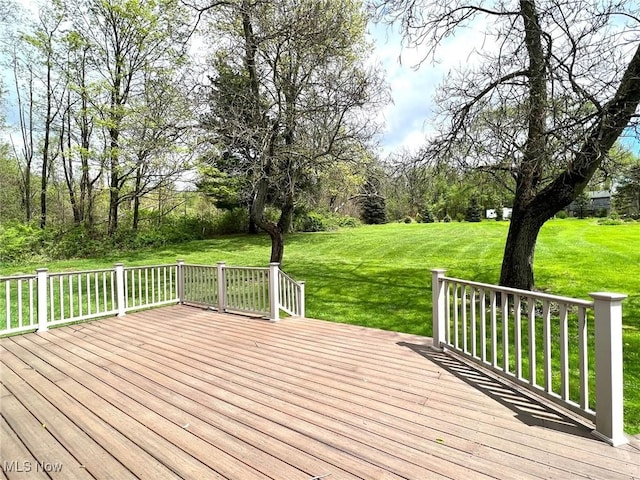 wooden terrace with a yard