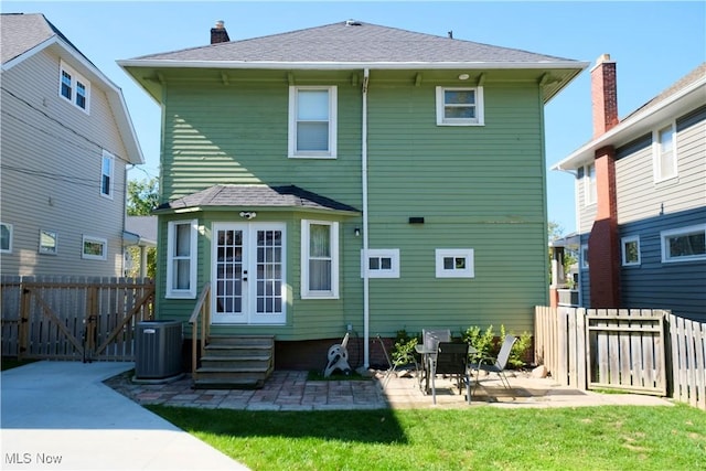 rear view of house featuring a patio, a gate, french doors, fence private yard, and entry steps