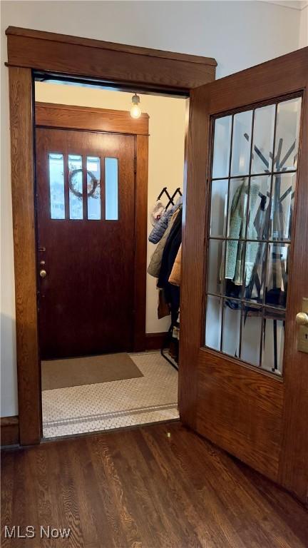 doorway featuring wood finished floors