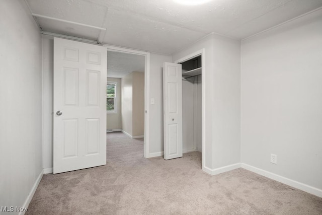 5331 Ridgewood St, Lorain, OH 44055 - unfurnished bedroom with baseboards, a closet, and carpet