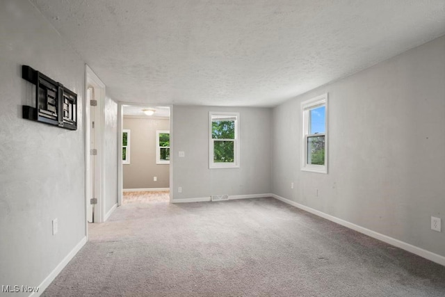5331 Ridgewood St, Lorain, OH 44055 - spare room with carpet, baseboards, and a textured ceiling