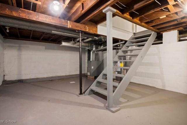 5331 Ridgewood St, Lorain, OH 44055 - unfinished basement featuring heating unit and stairway