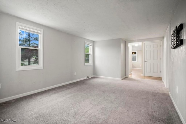 5331 Ridgewood St, Lorain, OH 44055 - carpeted spare room with a textured ceiling and baseboards
