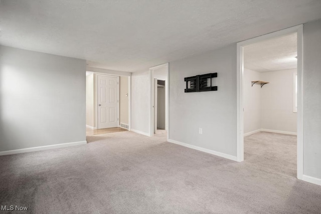 5331 Ridgewood St, Lorain, OH 44055 - unfurnished room with baseboards, a textured ceiling, and carpet floors