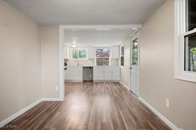 5331 Ridgewood St, Lorain, OH 44055 - interior space with a textured ceiling, wood finished floors, and baseboards
