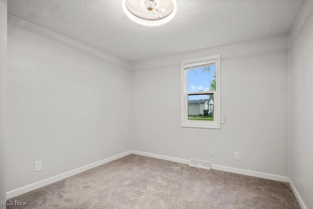 5331 Ridgewood St, Lorain, OH 44055 - spare room featuring baseboards, a textured ceiling, visible vents, and carpet floors