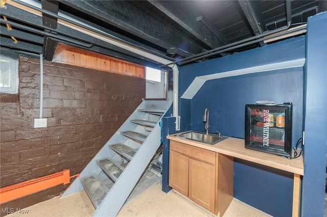 3019 Clague Rd, North Olmsted, OH 44070 - basement featuring stairs, a sink, and wet bar