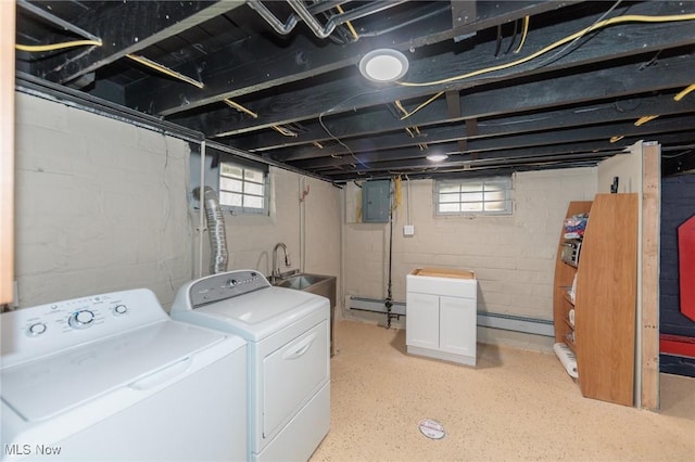 3019 Clague Rd, North Olmsted, OH 44070 - washroom with electric panel, a sink, a baseboard heating unit, laundry area, and washer and dryer