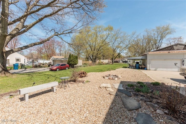 3019 Clague Rd, North Olmsted, OH 44070 - view of yard featuring an attached garage and driveway