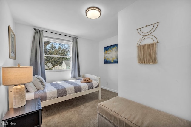 carpeted bedroom featuring baseboards