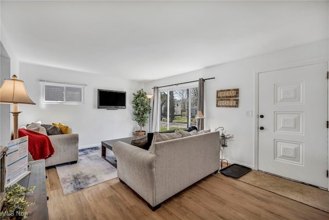 living room with wood finished floors