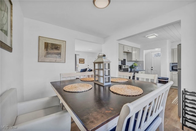 dining room with light wood-style floors