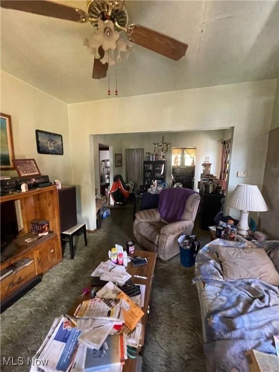 living area with carpet flooring and ceiling fan