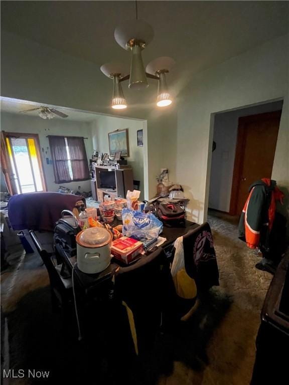 dining area with ceiling fan and carpet floors