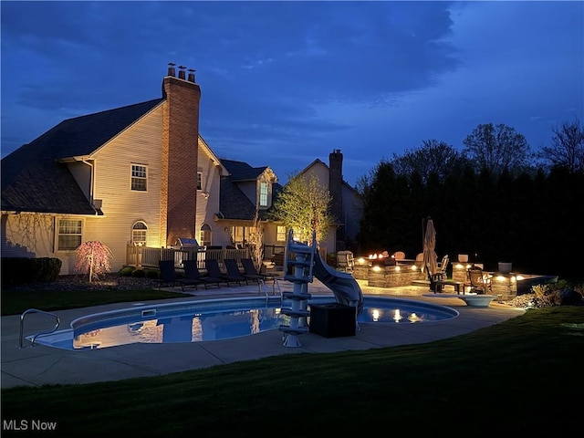 7966 Meadowbrooke Trl, Poland, OH 44514 - outdoor pool with a yard, a patio area, and a water slide