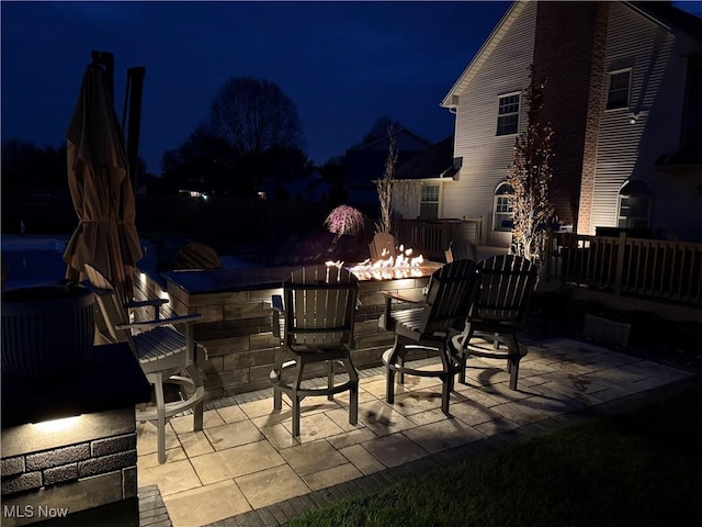 7966 Meadowbrooke Trl, Poland, OH 44514 - patio at twilight featuring a fire pit