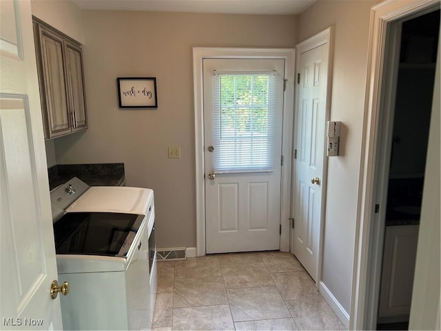 7966 Meadowbrooke Trl, Poland, OH 44514 - washroom with washing machine and dryer, cabinet space, and baseboards