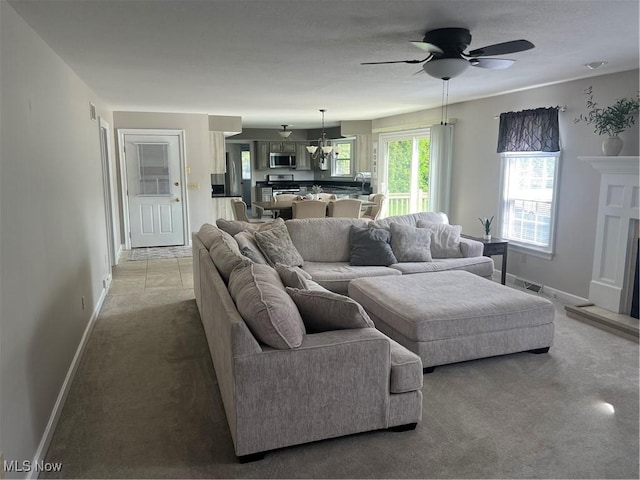 7966 Meadowbrooke Trl, Poland, OH 44514 - living room with ceiling fan, light carpet, baseboards, and visible vents