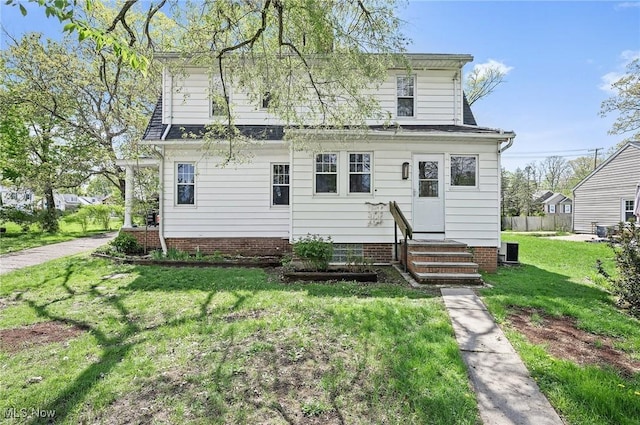 view of front of home with a front lawn and entry steps