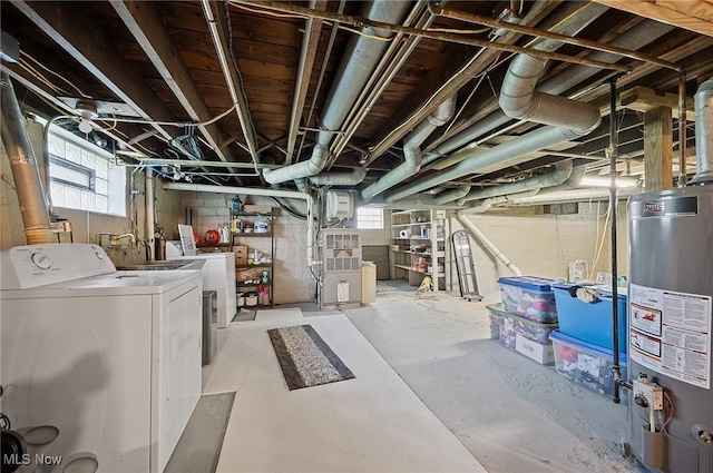 below grade area with independent washer and dryer, plenty of natural light, and gas water heater