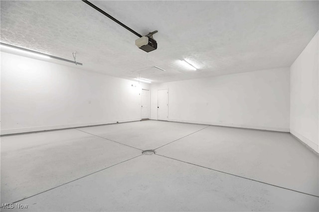 10836 Watercress Rd, Strongsville, OH 44149 - garage featuring baseboards and a garage door opener