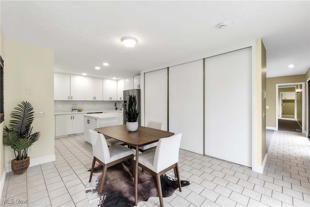 10836 Watercress Rd, Strongsville, OH 44149 - dining space featuring baseboards, light tile patterned flooring, and recessed lighting