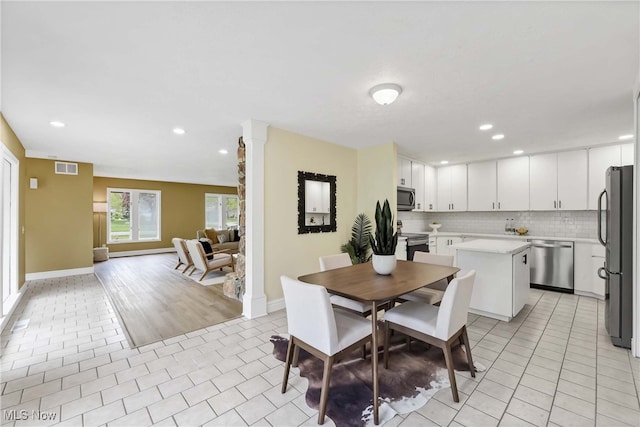 10836 Watercress Rd, Strongsville, OH 44149 - dining space featuring light tile patterned floors, visible vents, baseboards, and recessed lighting
