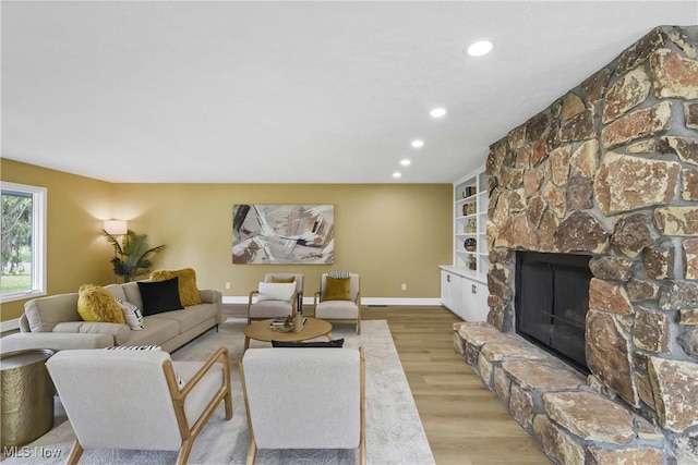 10836 Watercress Rd, Strongsville, OH 44149 - living area with baseboards, a fireplace, recessed lighting, and wood finished floors